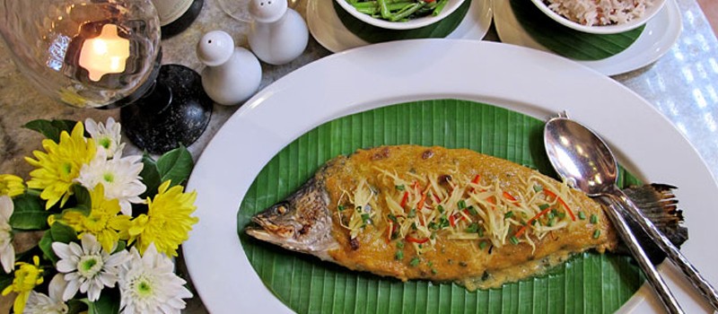 Pla Ob Khing Tao Jiew by Chef Darren Wiper at Mom Tri’s Villa Royale, Kata — baked sea bass with yellow bean curry and sautéed morning glory.
