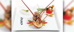 Phuket Lobster Fusion Thermidor by Chef Cedric Combe at Dokbua Restaurant, Mai Khao — baked lobster with shiitake, soy-ginger béchamel, and Thai barbecue sauce.