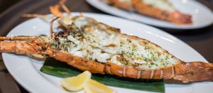 Phuket Lobster Thermidor by Chef Nuttanun “Pui” Yatajareanrod at Palm Seaside, Bang Tao — baked Phuket lobster with creamy mustard hollandaise and mushrooms.