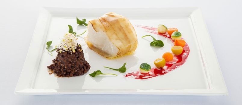 Barramundi Potatoes and Lentils by Chef Francesco Greco at Cape Sienna Hotel & Villas, Kamala — potato-wrapped barramundi served with Italian lentil stew.
