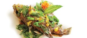 Royal Allamanda Grouper by Chef Songwut Monthirakanok at Allamanda Laguna Phuket — crispy whole grouper topped with tamarind and Thai herbs.