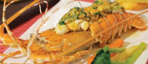 Laimai Flambé by Chef Sitthidech Yeesunsri at Laimai Courtyard, Patong — lobster flambéed in coconut cream, white wine, and Pernod.