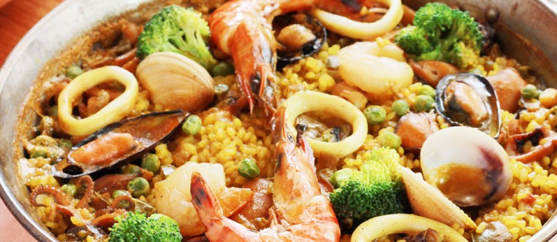 Seafood Paella by Chef Raul Velarde at La Bodega Tapas Bar, Patong — traditional Spanish rice dish with squid, mussels, clams, and tiger prawns.