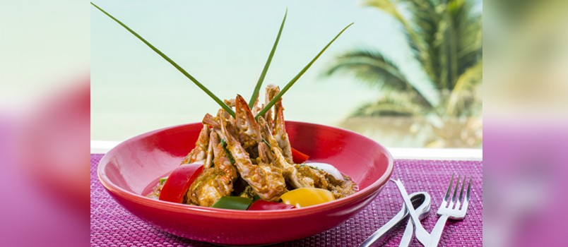 Poo Phad Pong Karee by Chef Chatchanan “Ann” Punjasuphachok at The Nai Harn, Phuket — blue crab curry stir-fried with egg, chili oil, and vegetables.
