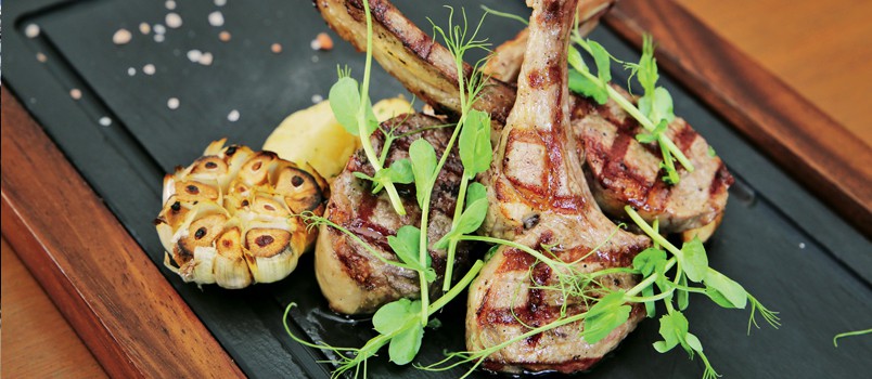 Costolette di Agnello alla Griglia by Chef Marco Cacia at Bodega & Grill, Angsana Laguna Phuket — grilled lamb chops served with baby potatoes, cherry tomatoes, and rosemary jus.