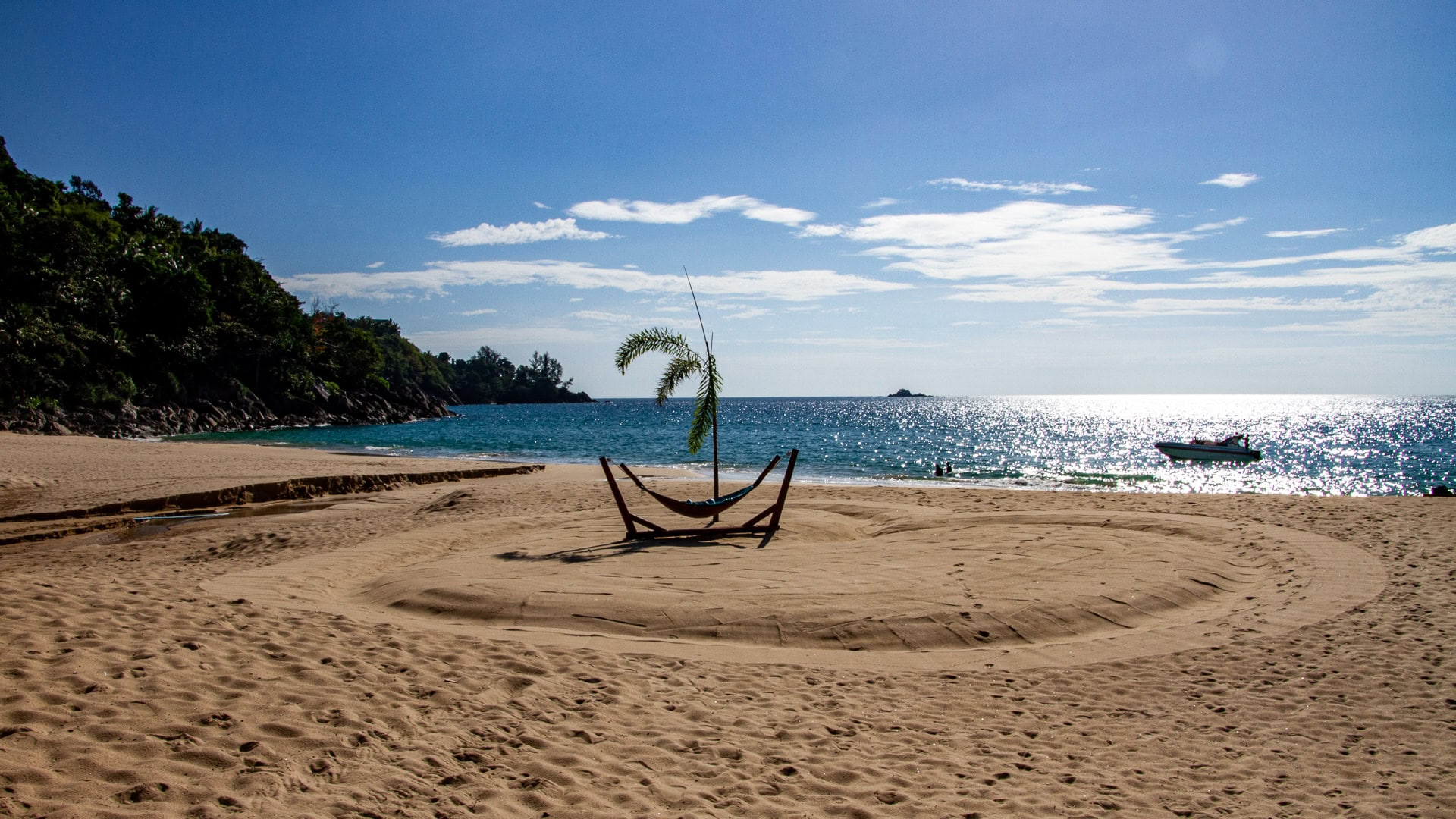 White Beach Phuket small secluded sandy cove with rocky headlands and turquoise water.