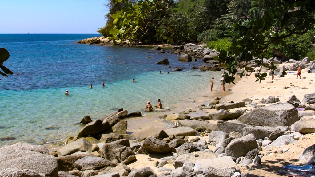 Ao Sane Beach Phuket rocky beach section with uneven sand and stones