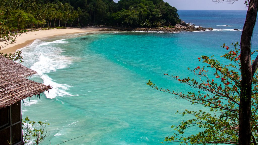 Freedom Beach Phuket cove with turquoise water and curved white sand shoreline