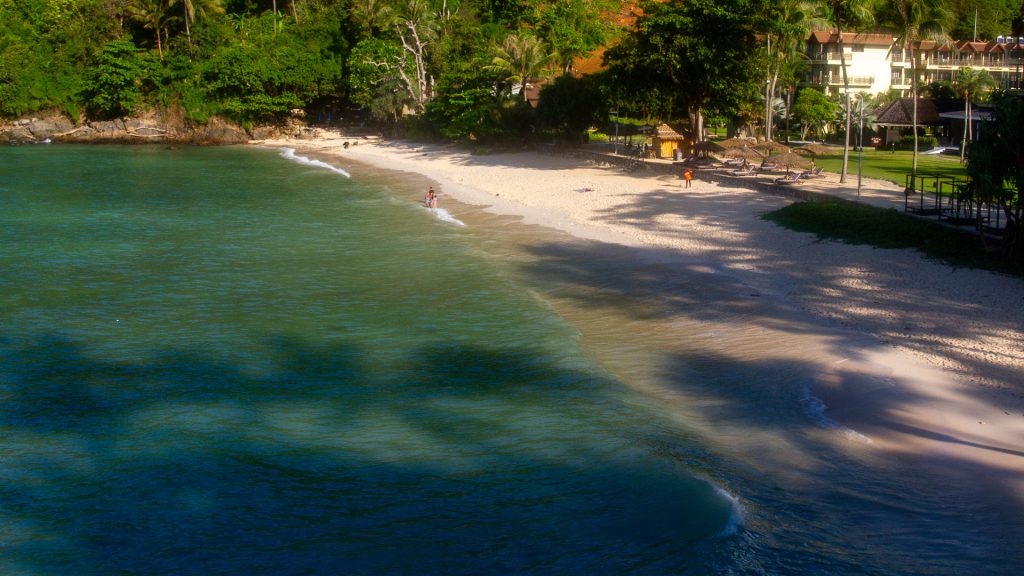 Merlin Beach Phuket aerial view with green hillside and calm bay