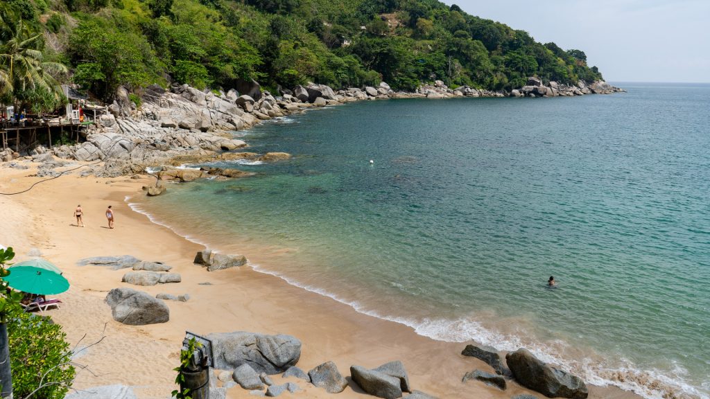 Nui Beach Phuket seating deck overlooking the sea and rocky coastline
