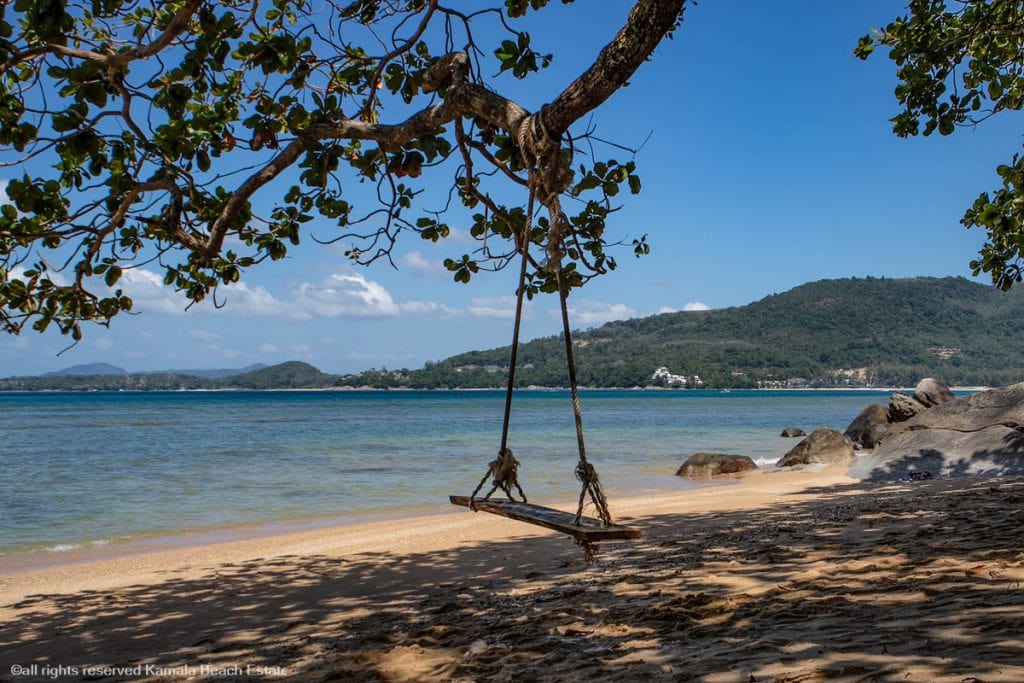 Rayee Beach Phuket wide view of sand, sea, and hillside in the background