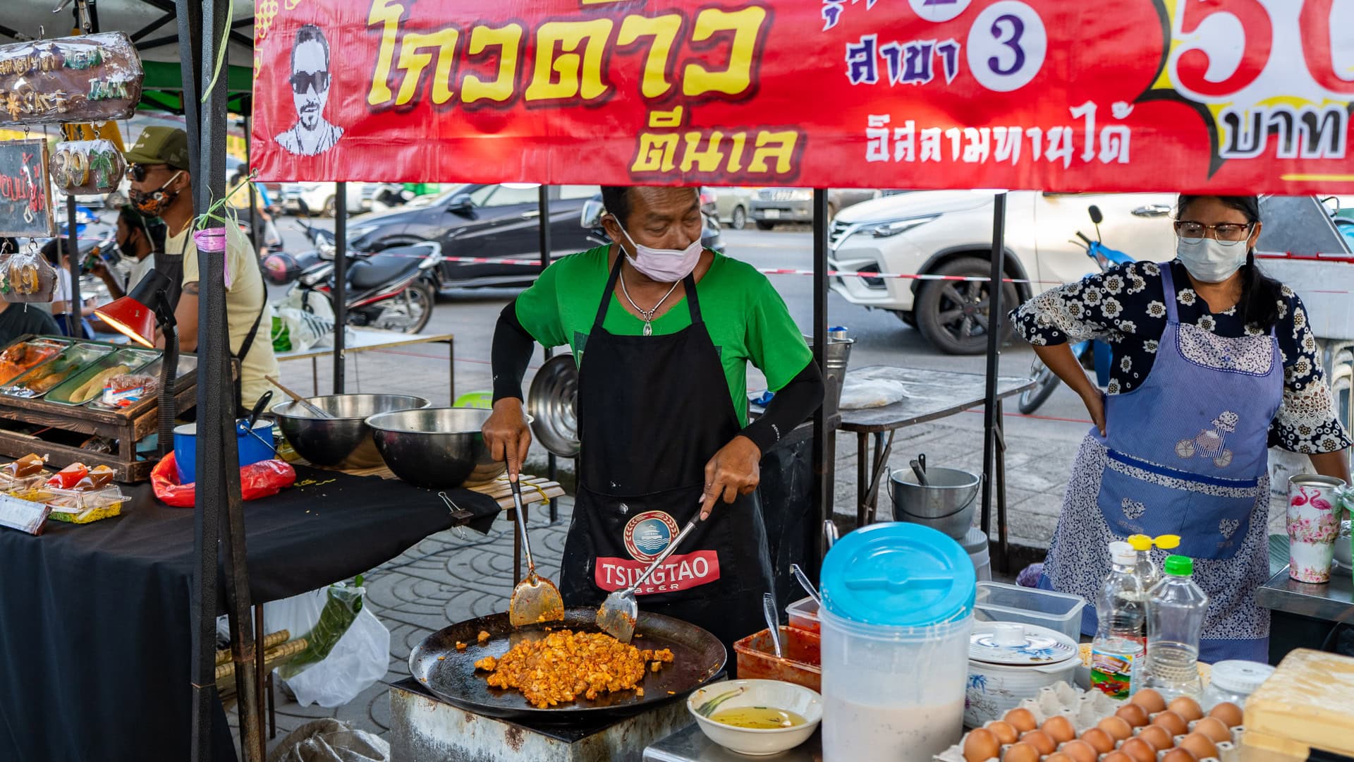 Fresh fruit shake being prepared at Chaeng Talay Street Food Market, with fruit cut and blended at a roadside stall.
