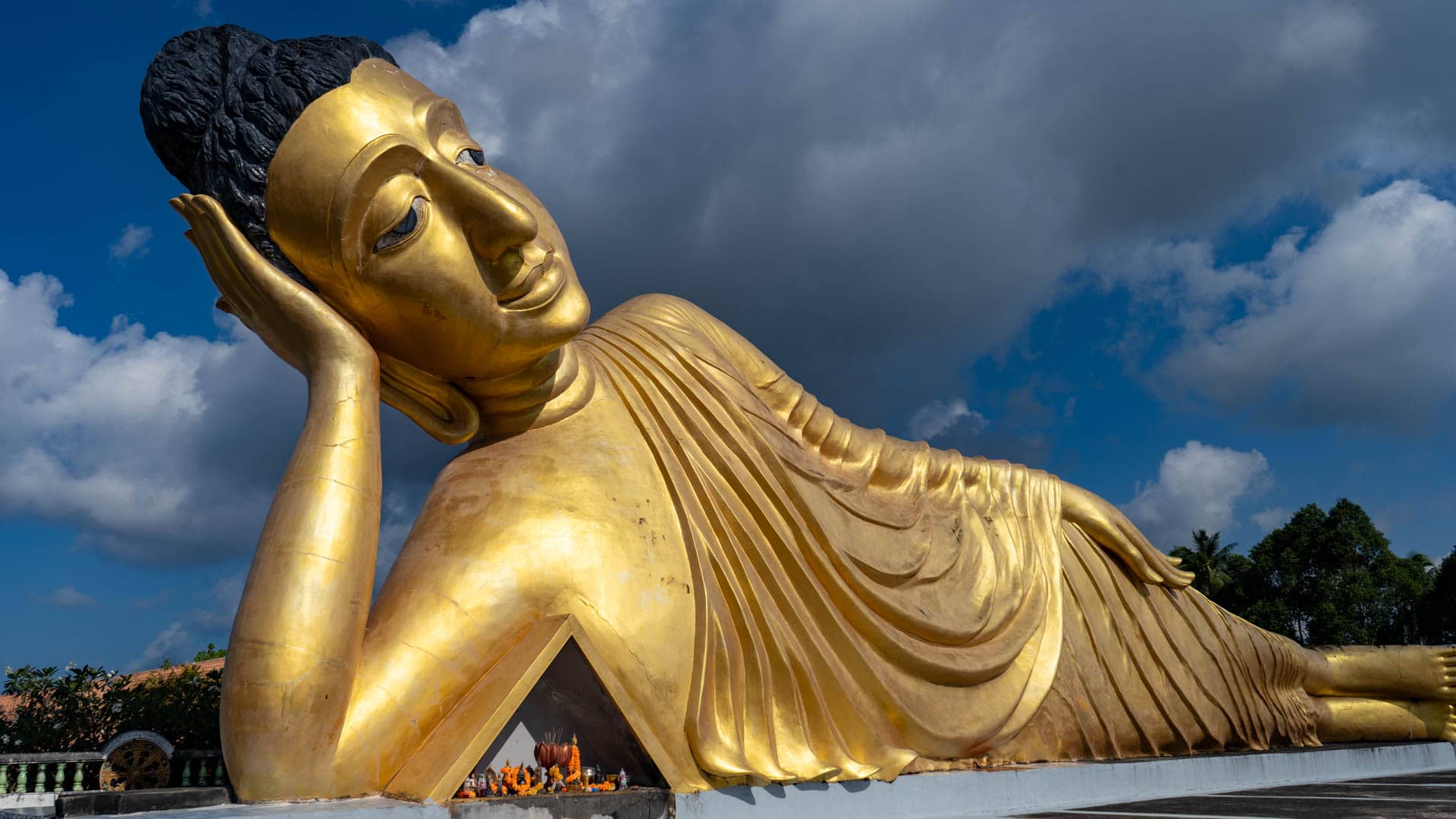 Side view of reclining Buddha with offering recess at Wat Sri Sunthon