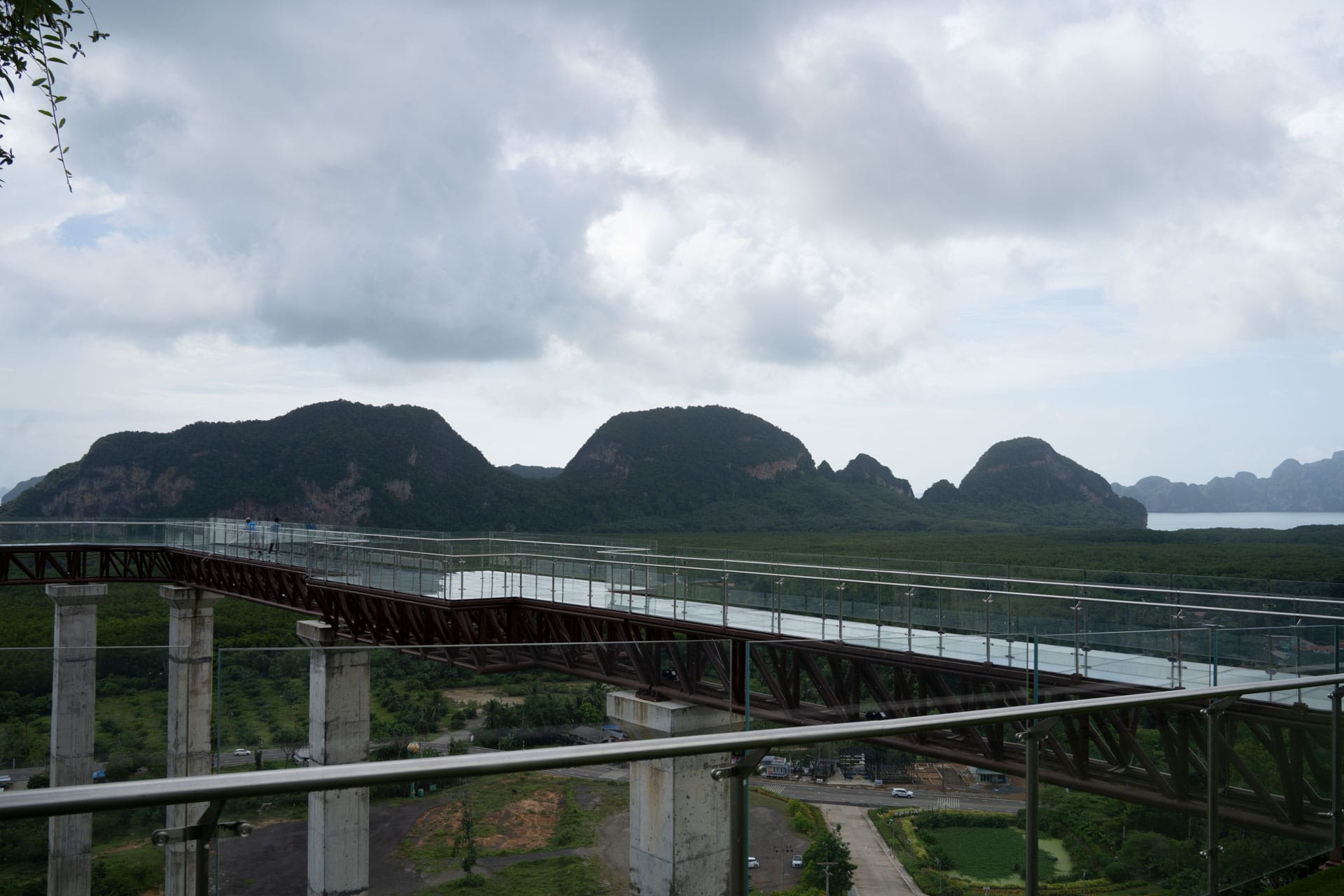 Elevated skywalk overlooking the limestone landscape at Samet Nangshe