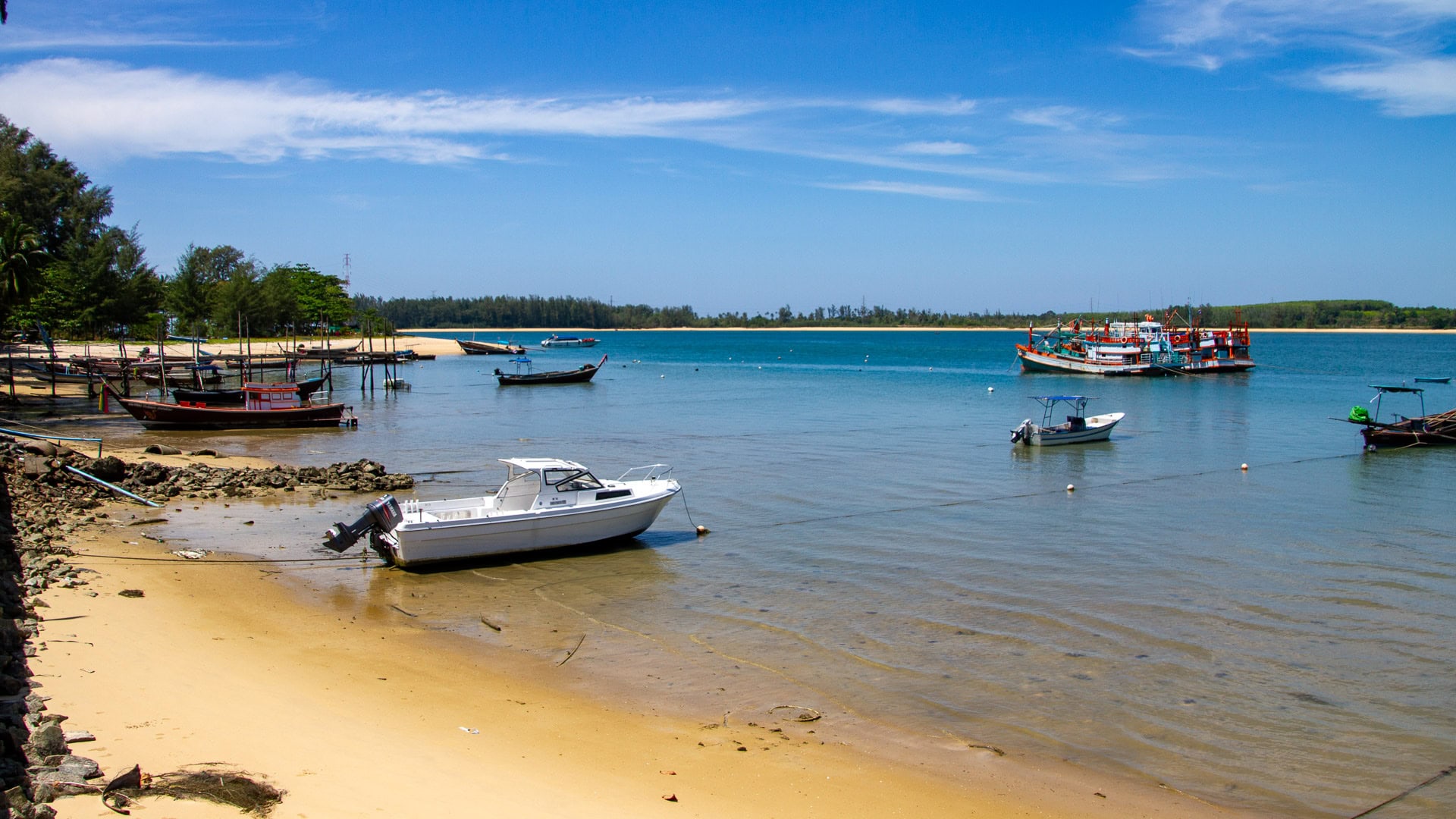 Haad Pak Phra Beach is a quiet northern beach at the edge of Phuket, known for natural casuarina forests, soft sand, and peaceful atmosphere.