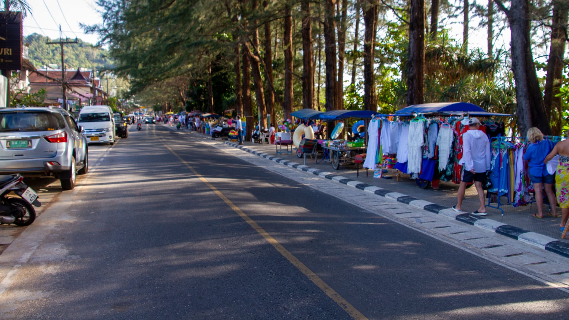 Naithon Beach Phuket small guesthouses and restaurants lining the gently curving village road behind the beach.