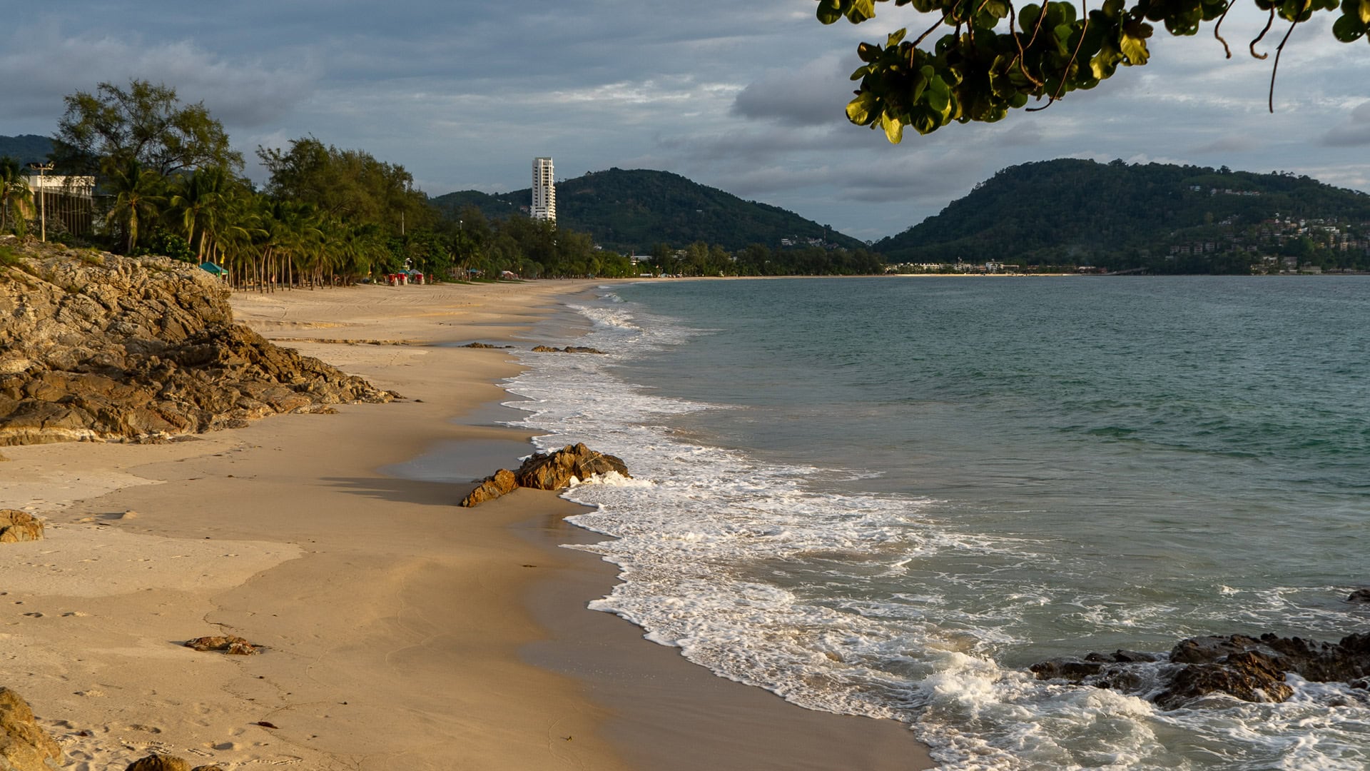 Kalim Beach Phuket wide view of rocky shoreline and open sea