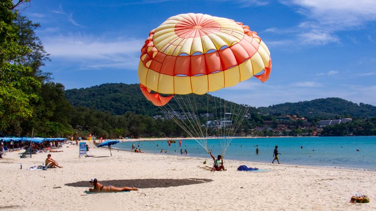 Parasailing activity on the sand at Kata Beach Phuket.