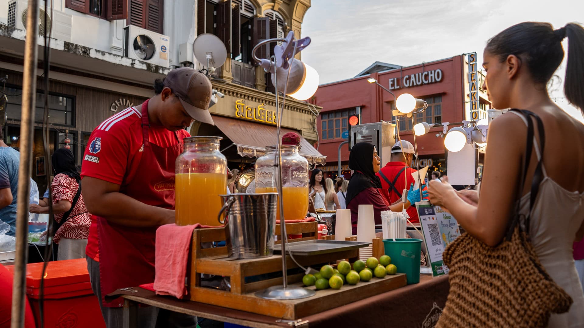 You stop for a moment as juice is poured slowly, one glass at a time, while the line waits.
