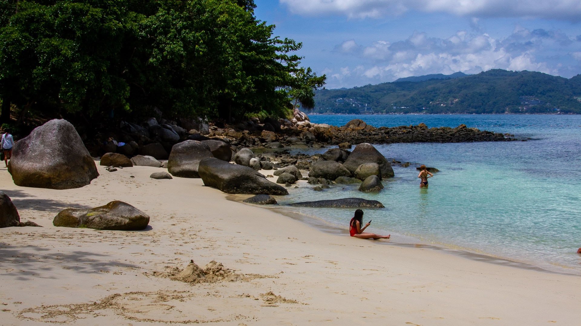 Paradise Beach Phuket shoreline curving around sheltered headland