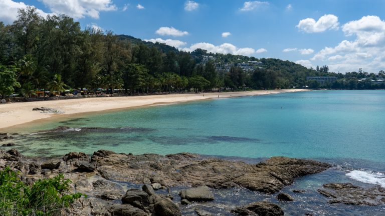 Mid-beach view towards the northern headland at Surin Beach Phuket.