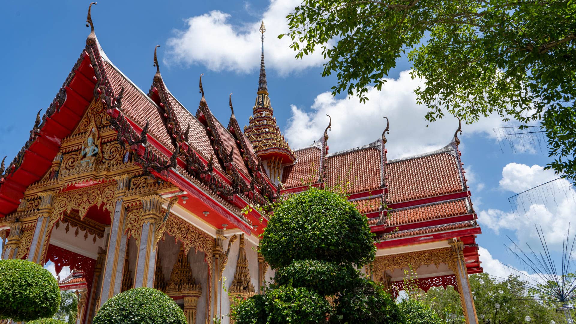 Ornate rooflines and gables of Wat Chalong ordination hall Phuket