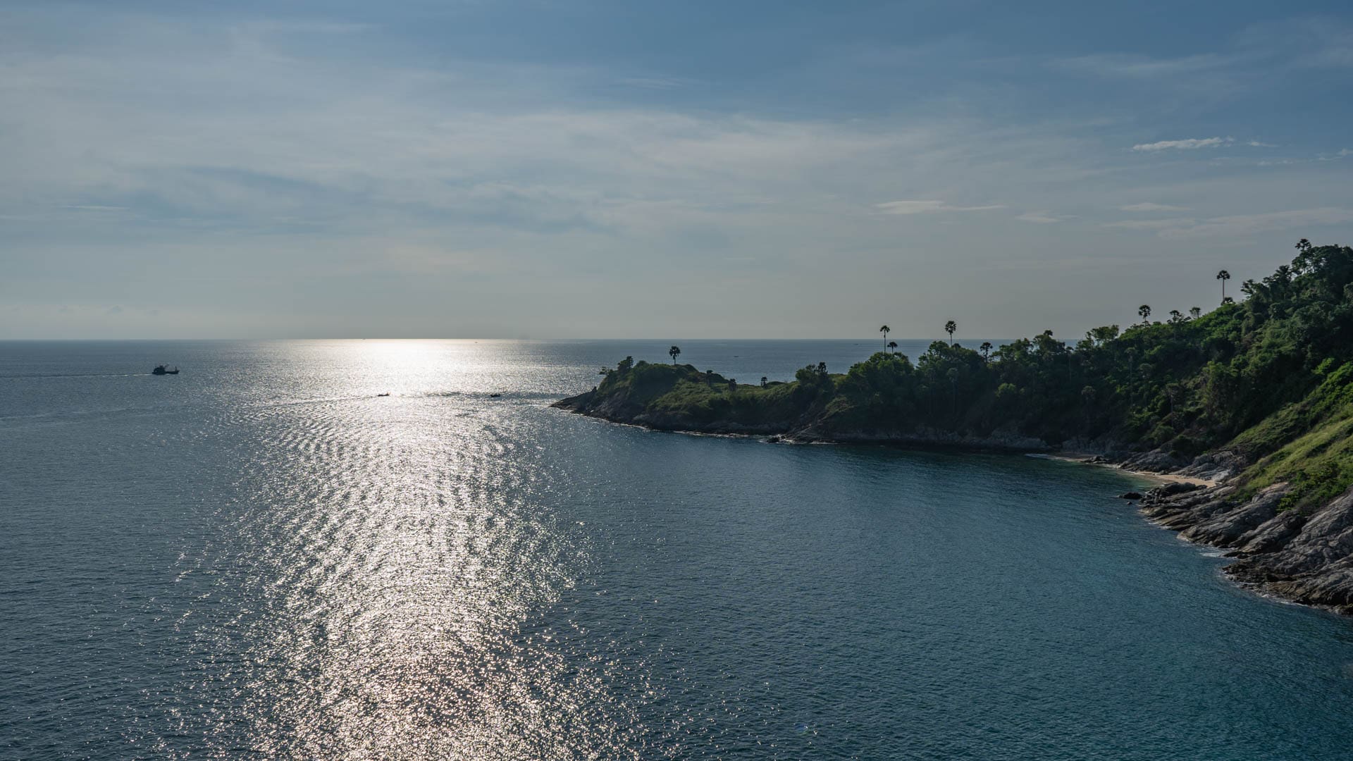 Andaman Sea coastline and rocky headland below Phromthep Cape viewpoint in southern Phuket